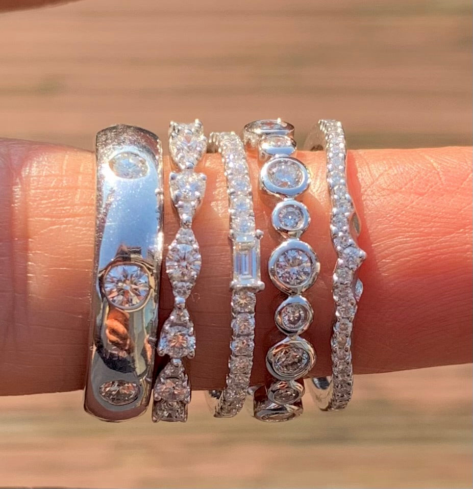 Stack of white gold & diamond rings