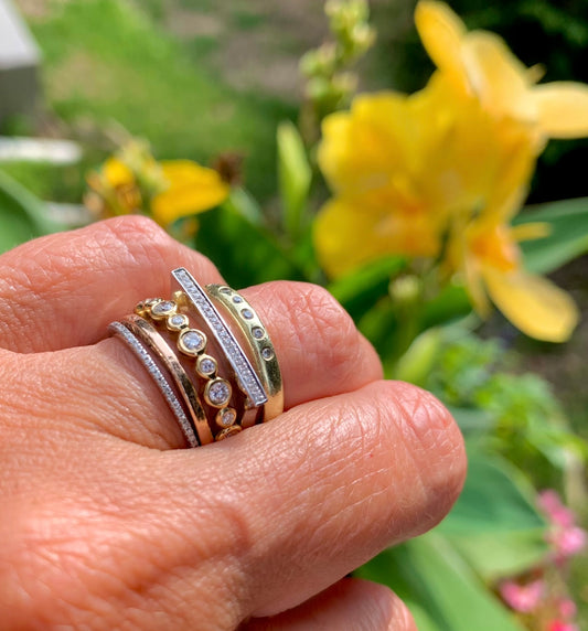 Stack of 14k gold & diamond bands